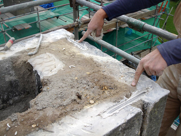 Chimney: steel ties to masonry.