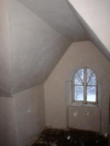 Attic room: finished lime plaster on lath.