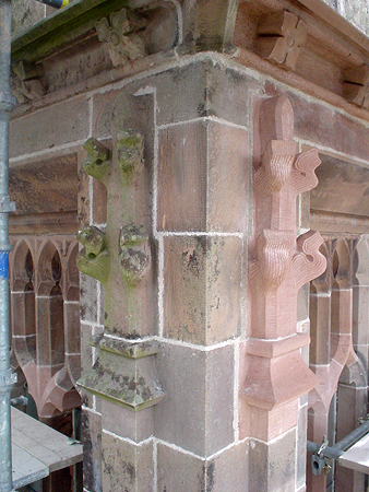 Comparison between existing and replacement carved masonry finials and string courses.