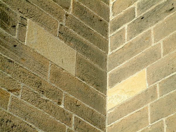 Detail of masonry repointing and indenting.