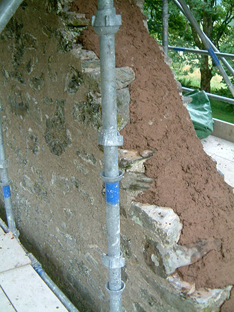 During works: puddle clay bonded onto masonry substrate.