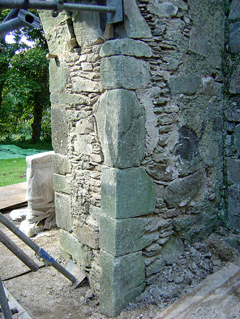 During works: right hand side doorway, internal: reconstruction of jambs in lime mortar and carefully selected stone.