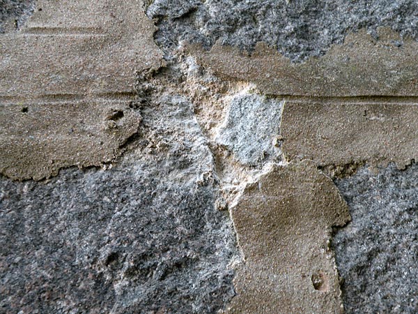 Cementitious mortar over original lime mortars.