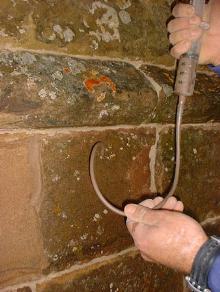 Mortar repair: gravity grouting to masonry.