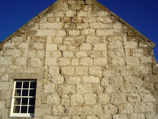 Gable wall: note condition of masonry and extent of repointing works.