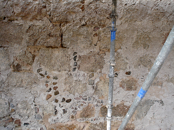 Preparation works to walls prior to lime harling.