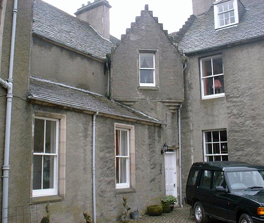 Ballindalloch Castle courtyard: brittle cement harling.
