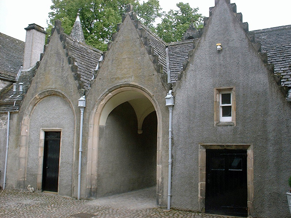 Courtyard entrance: brittle cement harling.