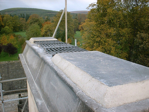 Chimney repair: note grilled vents.