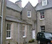 Ballindalloch Castle courtyard: brittle cement harling.