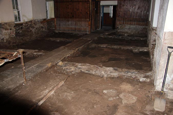 Internal flagstones: uplift and archaeological inspection.