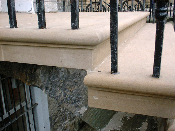 After works: detail of masonry arch and railings.