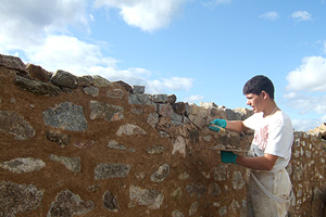 Photograph of a Maltese Student doing Traditional Lime Pointing